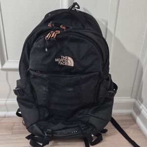 The North Face Black Backpack with Brown Details